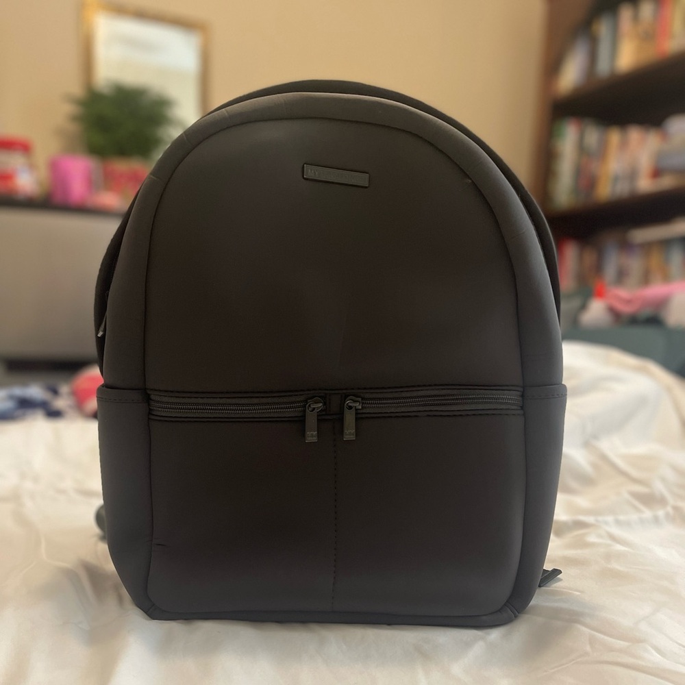 My tag alongs Hunter green backpack